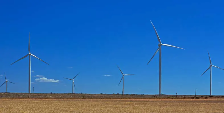 Wind turbines against a blue sky. 