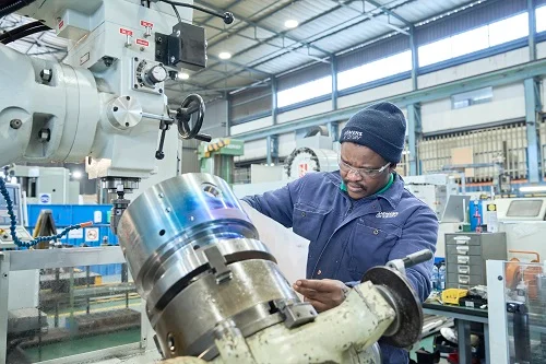 A Siemens Energy worker attending to a piece of equipment. 