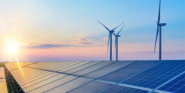 Wind turbines and solar panels. 