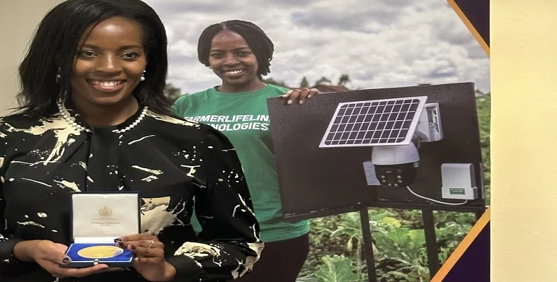 Esther Kimani posing with her prize. 