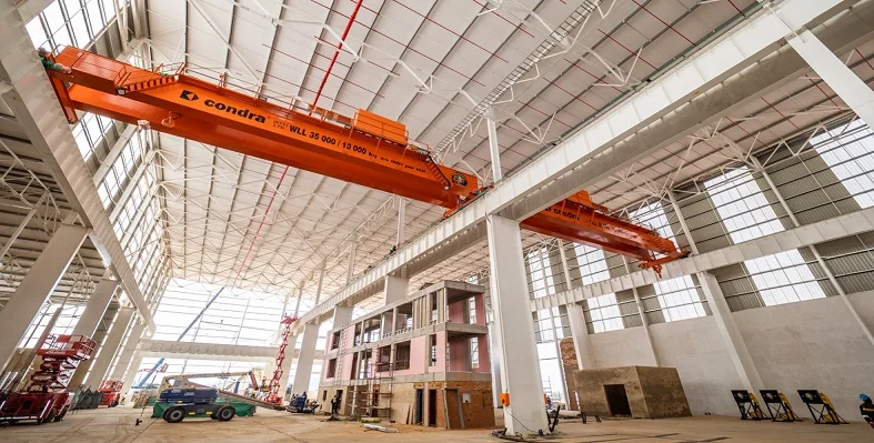 A.	Condra overhead cranes in a factory environment.