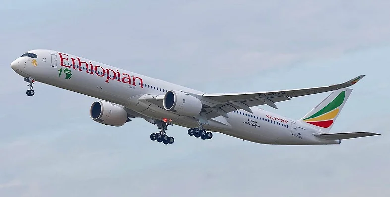 A aircraft in the sky branded with Ethiopian Airlines colours and name