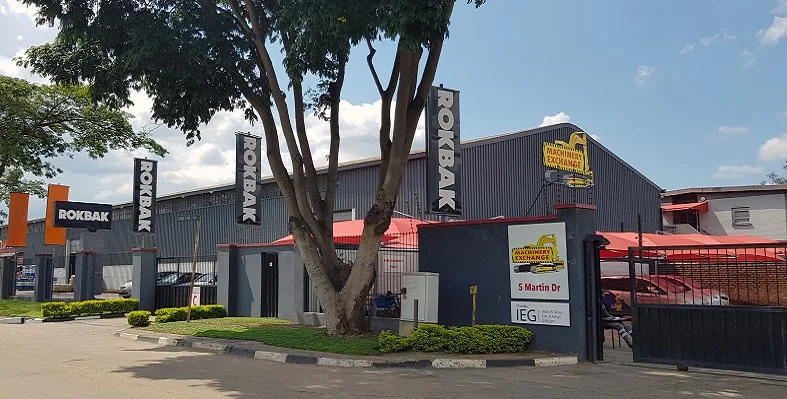 A Machinery Exchange warehouse with Rokbak flags out front.