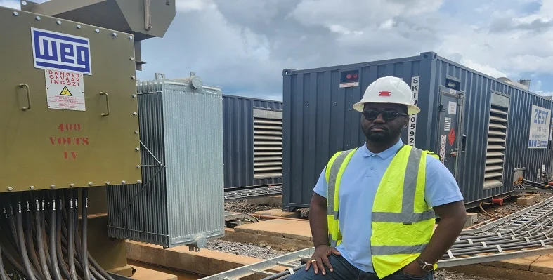 Thierry Kakese, WEG’s regional manager – Central Africa, in front of WEG transformers on a mine in the DRC. 