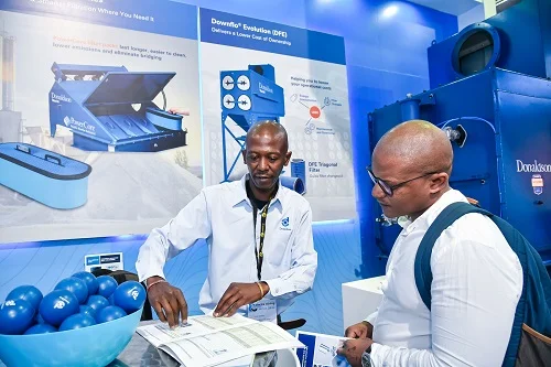 An exhibitor speaking to a visitor at a previous edition of Electra Mining