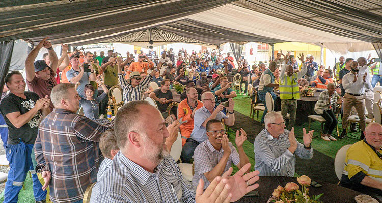 Murray & Roberts Cementation and PMC employees celebrate the new ventilation shaft. 