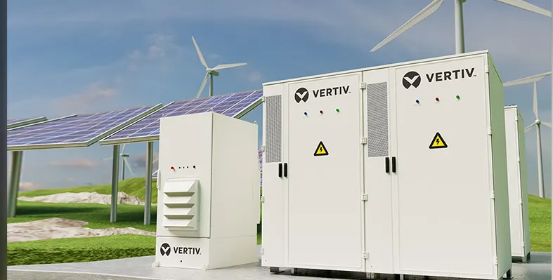 Vertiv DynaFlex BESS with solar panels and wind turbines in the background.