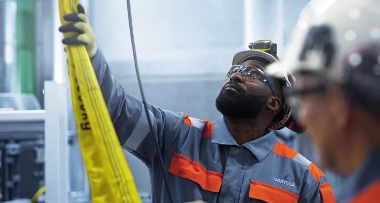 A Wärtsilä employee at work in a facility. 