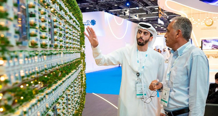 Two people inspecting new technology at a conference.